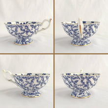 Load image into Gallery viewer, Antique bone china teacup and saucer with a subtle scalloped edge with transferware pattern of cobalt blue maple leaves, French loop handle with thumb rest, and edges trimmed with gold gilt. Crafted by Coalport, England, circa 1920s. In excellent condition, free from chips, cracks and repairs. Marked &quot;Crafted by Coalport Bone China, England, AD1750&quot; with the pattern number in gold. Teacup measures 4 x 2 1/4 inches | Saucer measures 5 ½ inches
