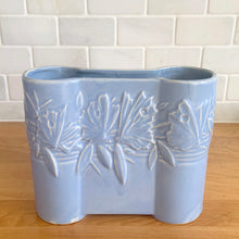 Load image into Gallery viewer, Vintage Art Deco matte blue Castle Gate Butterfly Line vase. Crafted by Nelson McCoy Pottery, early 1940s. This rare piece is must for any art pottery collector!

In excellent condition, no chips/repairs, crack, see photos. Unmarked.

Measures 7 3/8 x 2 1/2 x 6 inches
