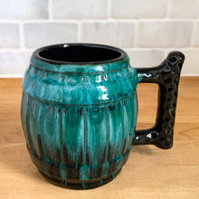Load image into Gallery viewer, Three-quarter front view of the Blue Mountain Pottery green drip glaze mug measuring 5¼ × 4 × 4 inches (including handle)
