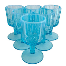 Load image into Gallery viewer, Angled front view of six vintage Westmoreland blue opalescent paneled grape goblets showing available stock
