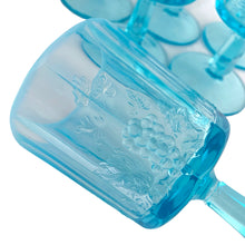 Load image into Gallery viewer, Close-up of raised paneled grape and vine relief pattern on Westmoreland blue opalescent goblet
