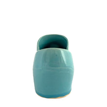 Load image into Gallery viewer, Vintage light blue figural Dutch shoe ceramic planter featuring an applied pink rose and green leaves. Crafted by McCoy Pottery, USA, 1947. Use this adorable planter to house your favourite succulent. In excellent condition, no chips/cracks/repairs. Measures 7 1/2 x 2 3/4 x 3 1/4 inches
