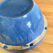 Load image into Gallery viewer, Rare vintage depression era blue salt glazed stoneware mixing bowl featuring the classic art deco &quot;Picket Fence&quot; design. Crafted by the UHL Pottery Company, USA, circa 1930s. These bowls are hard to come by and are coveted by collectors. A beautiful country farmhouse display piece. A utilitarian piece that has stood the test of time. excellent condition. A few minor flea bites on the bottom rim. Normal manufacturer&#39;s defects in the glaze. Marked USA on the bottom. Measures 10 1/2 x 5 1/2 inches
