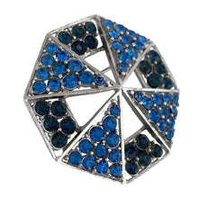 Load image into Gallery viewer, Angled view of vintage blue rhinestone geometric brooch showing depth of silver-tone triangular openwork sections and two-tone stones
