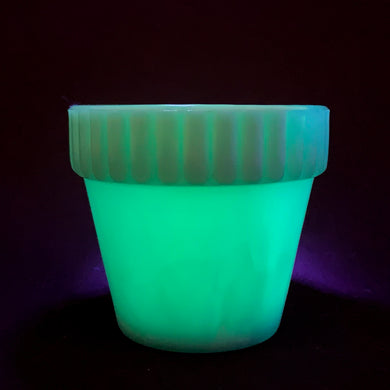 Vintage blue slag glass flower pot with ribbed pan. Produced by Akro Agate, circa 1940s. Use as intended with a small houseplant or succulent, or repurpose as a toothpick holder or upscale your office and use this as a paperclip holder. Best of all this little beauty glows beautifully under black light!  In good vintage condition, free from chips/cracks. Marked 300F, Made in the USA.   Measures 3 x 2 3/16 inches