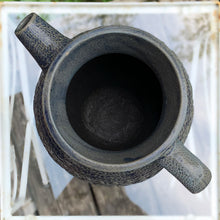 Load image into Gallery viewer, Rare vintage blue stoneware batter jug or pitcher decorated with panels of a figure playing a lyre against a stippled ground with decorative details. Crafted by Robinson Ransbottom Pottery Co., USA, 1920s.

In good used vintage condition, minor flea bites to the rim and foot. Normal age-related crazing. Unmarked.

Measures 9 x 10 1/2 inches (incl. spout/handle)

