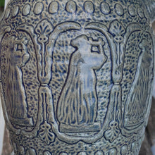 Load image into Gallery viewer, Rare vintage blue stoneware batter jug or pitcher decorated with panels of a figure playing a lyre against a stippled ground with decorative details. Crafted by Robinson Ransbottom Pottery Co., USA, 1920s.

In good used vintage condition, minor flea bites to the rim and foot. Normal age-related crazing. Unmarked.

Measures 9 x 10 1/2 inches (incl. spout/handle)
