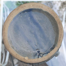 Load image into Gallery viewer, Rare vintage blue stoneware batter jug or pitcher decorated with panels of a figure playing a lyre against a stippled ground with decorative details. Crafted by Robinson Ransbottom Pottery Co., USA, 1920s.

In good used vintage condition, minor flea bites to the rim and foot. Normal age-related crazing. Unmarked.

Measures 9 x 10 1/2 inches (incl. spout/handle)
