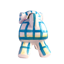 Load image into Gallery viewer, Adorable kitschy white puppy dog planter with blue stripes, black stitching and a pink bow. Crafted by Napco, Japan, 1950s. A sweet addition for your new addition. Use for tiny plants or repurpose to hold baby accessories.

In excellent as found vintage condition, no chips/cracks/repairs, normal crazing present.

Measures 5 3/4 x 3 x 5 1/4 inches

