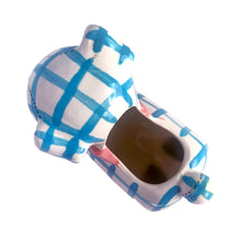 Load image into Gallery viewer, Adorable kitschy white puppy dog planter with blue stripes, black stitching and a pink bow. Crafted by Napco, Japan, 1950s. A sweet addition for your new addition. Use for tiny plants or repurpose to hold baby accessories.

In excellent as found vintage condition, no chips/cracks/repairs, normal crazing present.

Measures 5 3/4 x 3 x 5 1/4 inches
