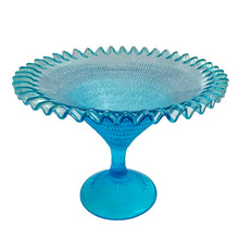 Load image into Gallery viewer, Exquisite blue glass pedestal compote featuring a textured exterior finish and crimped edge. Crafted by Zabkowice Glassworks, Poland, circa 1970s. Enhance your home decor with this stunning piece of art glass! In excellent condition, free from chips. Measures 11 x 8 inches
