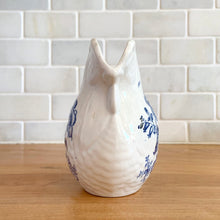 Load image into Gallery viewer, Vintage figural chicken ironstone creamer featuring blue transferware florals. Crafted by Crown Devon Fieldings, England, 1930s. Add a touch of cottage charm to your tableware with this adorable creamer.

In excellent condition, no chips/cracks/repairs, crazing and minor staining present. Marked Crown Devon Fieldings Staffordshire England Acid Resistant.

Measures 5 1/4 x 3 x 3 3/4 inches
