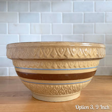 Load image into Gallery viewer, Vintage yellow ware mixing bowl featuring brown and blue bands with diamond pattern. Crafted by Robinson Ransbottom, USA, 1930s. A well-crafted piece of stoneware offering a nostalgic vibe to your farmhouse or cottage kitchenware and decor!

Option 3, 9 Inch: Measures 9 3/8 x 4 7/8 inches. In as found condition, flea bite at foot, age-related crazing and staining. Crown mark.
