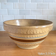 Load image into Gallery viewer, Vintage yellow ware mixing bowl featuring brown and blue bands with diamond pattern. Crafted by Robinson Ransbottom, USA, 1930s. A well-crafted piece of stoneware offering a nostalgic vibe to your farmhouse or cottage kitchenware and decor!

Option 3, 9 Inch: Measures 9 3/8 x 4 7/8 inches. In as found condition, flea bite at foot, age-related crazing and staining. Crown mark.
