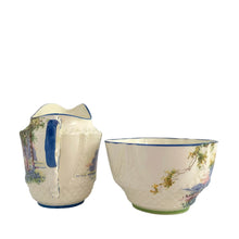 Load image into Gallery viewer, Vintage Bluebell Time bone china creamer and sugar featuring a delicately shaped vessels decorated with springtime woodland scene with bluebell flowers amongst groves of trees and trimmed in blue. Crafted by Aynsley, England, 1934 - 1950s.

In excellent condition, no chips/cracks/repairs. Maker&#39;s mark present with Bluebell Time and As supplied to H.M. the Queen.

Creamer measures 2 1/2 x 3 1/8 inches

Sugar measures 3 1/4 x 1 7/8 inches
