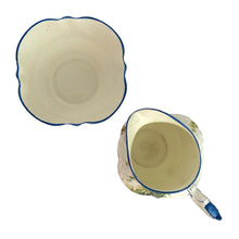 Load image into Gallery viewer, Vintage Bluebell Time bone china creamer and sugar featuring a delicately shaped vessels decorated with springtime woodland scene with bluebell flowers amongst groves of trees and trimmed in blue. Crafted by Aynsley, England, 1934 - 1950s.

In excellent condition, no chips/cracks/repairs. Maker&#39;s mark present with Bluebell Time and As supplied to H.M. the Queen.

Creamer measures 2 1/2 x 3 1/8 inches

Sugar measures 3 1/4 x 1 7/8 inches

