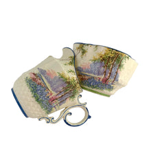 Load image into Gallery viewer, Vintage Bluebell Time bone china creamer and sugar featuring a delicately shaped vessels decorated with springtime woodland scene with bluebell flowers amongst groves of trees and trimmed in blue. Crafted by Aynsley, England, 1934 - 1950s.

In excellent condition, no chips/cracks/repairs. Maker&#39;s mark present with Bluebell Time and As supplied to H.M. the Queen.

Creamer measures 2 1/2 x 3 1/8 inches

Sugar measures 3 1/4 x 1 7/8 inches
