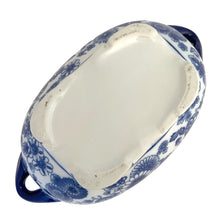 Load image into Gallery viewer, Base view of Bombay Company blue and white chinoiserie oval jardiniere showing the unglazed rectangular foot ring, age-appropriate wear, and floral border pattern on the exterior sides
