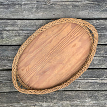 Load image into Gallery viewer, Pretty vintage Victorian oval wood tray featuring a braided natural wicker rim and handles  Sturdy and well made. In great vintage condition. Measures 20 3/4 x 13 3/4 inches
