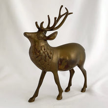 Load image into Gallery viewer, Vintage solid brass deer stag with antlers figurine. A wonderful piece to use for Christmas and holiday shelf, table or mantel decor.

In excellent condition with patina.

Measures 7 1/2 x 2 1/4 x 9 inches
