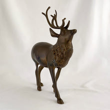 Load image into Gallery viewer, Vintage solid brass deer stag with antlers figurine. A wonderful piece to use for Christmas and holiday shelf, table or mantel decor.

In excellent condition with patina.

Measures 7 1/2 x 2 1/4 x 9 inches
