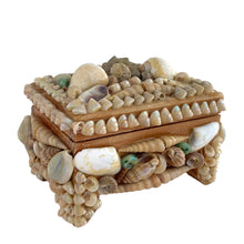 Load image into Gallery viewer, A charming mid-century artisan made trinket box handcrafted in Bremen, Germany, where maritime heritage runs deep despite the city's inland location. This piece exemplifies the golden age of shell art—a beloved souvenir tradition that flourished aboard luxury ocean liners like the SS Bremen and in European coastal gift shops. The wooden base is adorned with genuine shells, creating an authentic tactile surface that captures the romance of vintage travel. 
