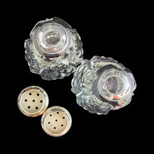 Load image into Gallery viewer, Enhance your tablescape with these sparkling vintage brilliant fine cut crystal tower-shaped salt and peppers shakers topped with sterling silver lids inlaid with mother-of-pearl....stunning!

The crystal is in excellent condition, no chips. The sterling silver lids show age related wear. Marked Sterling 925 with hallmark.

Measures 2 x 4 1/2 inches
