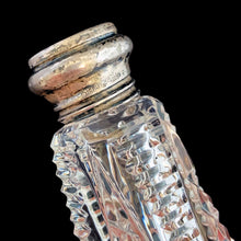 Load image into Gallery viewer, Enhance your tablescape with these sparkling vintage brilliant fine cut crystal tower-shaped salt and peppers shakers topped with sterling silver lids inlaid with mother-of-pearl....stunning!

The crystal is in excellent condition, no chips. The sterling silver lids show age related wear. Marked Sterling 925 with hallmark.

Measures 2 x 4 1/2 inches
