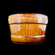 Load image into Gallery viewer, Vintage figural bucket ceramic pottery planter in a toffee coloured glaze. Produced UPCO, USA, circa 1970s. In as found vintage condition, 2 minor chips to the top bucket strap and a crack on the side. The planter is still useable. We recommend using it in conjunction with a liner. Stabilized the crack with epoxy or a weatherproof glue such as E6000. This pot is a fantastic piece and well worth the effort to give it a long life. Measures 7 x 4 3/8 inches
