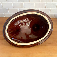 Load image into Gallery viewer, Vintage brown drip glaze hen-on-nest oven-proof casserole dish. Crafted by Hull Pottery, USA, 1960s. What a fabulous way to prepare and serve your favourite casserole!

In excellent condition, no chips/cracks/repairs. Maker's marks.

Measures 10 x 7 1/2 x 9 3/4 inches

