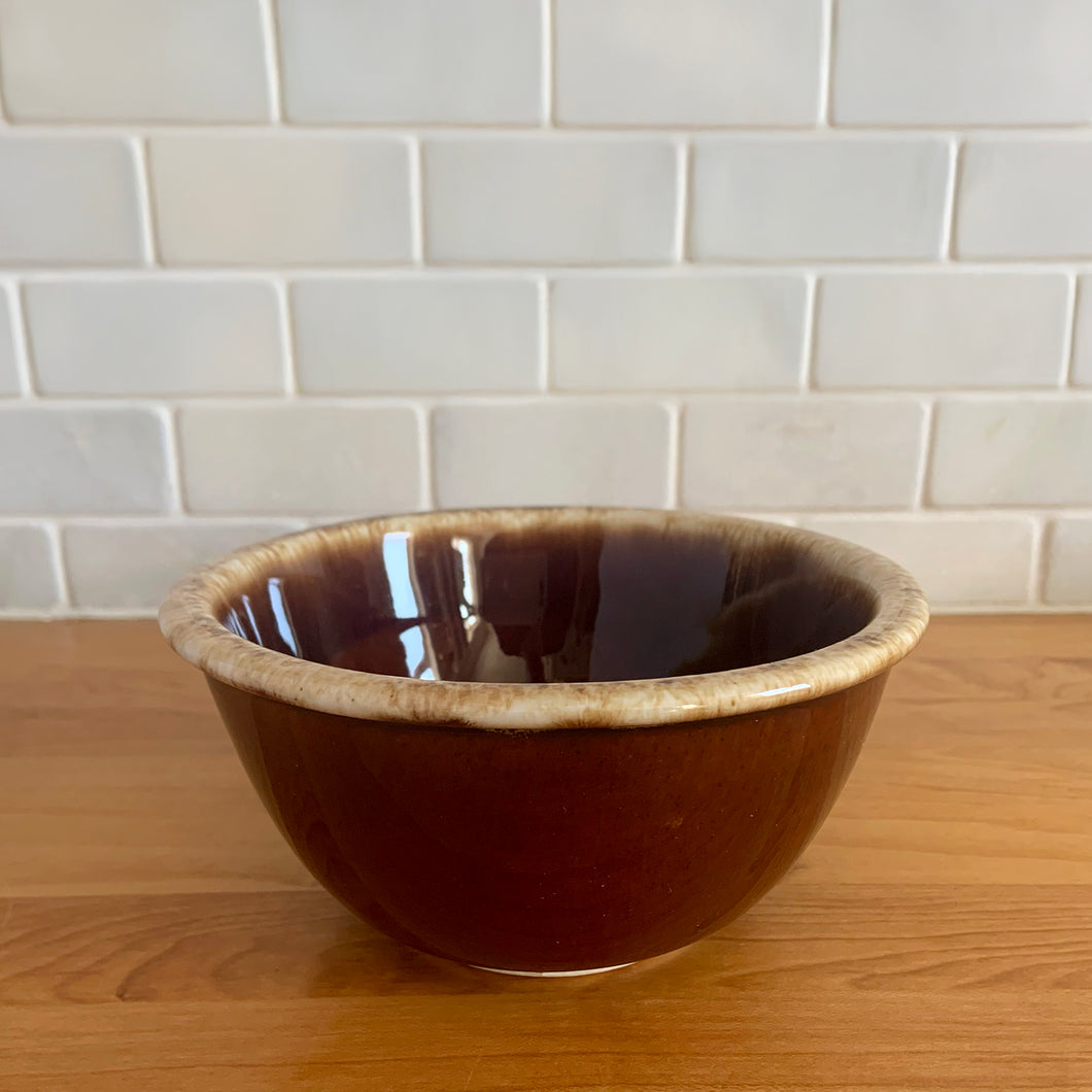 Vintage brown drip glaze oven-proof mixing bowls with rolled edge. Crafted by Hull Pottery, USA, 1960s. What a fabulous way to prepare or serve your favourite dish!

In excellent condition, no chips/cracks/repairs. Maker's marks.

Measures 6 Inch Bowl: 6 1/4 x 3 inches, in excellent vintage condition, no chips/cracks/repairs, minor wear. Maker's marks.