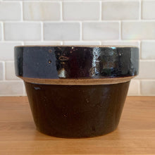Load image into Gallery viewer, Bring authentic primitive farmhouse charm into your space with this antique deep brown glazed stoneware flowerpot with unglazed rim. Makers of these pots were made in Pennsylvannia, USA, by manufacturers such as Enterprise Pottery and E.S.&amp;B. (Elverson and Sherwood &amp; Barker), from the late 1800s to the early 1900s. Simple, durable, and authentic, this Pennsylvannia-made piece has stood the test of time.
