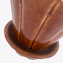 Load image into Gallery viewer, Striking vintage gloss brown Series 116 ribbed planter pot with attached saucer. Crafted by McCoy Pottery, 1940s. This rare planter is must for any McCoy art pottery collector!

In good vintage condition, flea bite at rim, hard water residue. Maker&#39;s mark on the bottom.

Measures 6 x 5 inches
