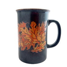Load image into Gallery viewer, Vintage brown ceramic mug featuring oak leaves and acorns in ochre and honey, with ochreinterior. Design by Stanley Papel. Crafted by Otagiri, Japan, 1970s. A lovely mug to add to your collection.

In excellent condition, no chips or cracks.

Measures 5 x 3 1/2 x 5 inches

Capacity 12 ounces
