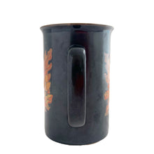 Load image into Gallery viewer, Vintage brown ceramic mug featuring oak leaves and acorns in ochre and honey, with ochreinterior. Design by Stanley Papel. Crafted by Otagiri, Japan, 1970s. A lovely mug to add to your collection.

In excellent condition, no chips or cracks.

Measures 5 x 3 1/2 x 5 inches

Capacity 12 ounces
