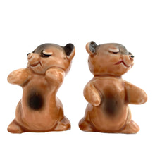 Load image into Gallery viewer, Vintage hand painted brown Snuggle Hugs hugging bears salt and pepper shakers. Designed by Ruth Van Tellingen, USA, 1940s. Add these adorable kitschy shakers to your collection!

In excellent condition, no chips/cracks/repairs. Faint impressed maker&#39;s mark on the bottom.

Measures 2 3/8 x 2 3/4 x 3 3/8 inches
