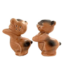Load image into Gallery viewer, Vintage hand painted brown Snuggle Hugs hugging bears salt and pepper shakers. Designed by Ruth Van Tellingen, USA, 1940s. Add these adorable kitschy shakers to your collection!

In excellent condition, no chips/cracks/repairs. Faint impressed maker&#39;s mark on the bottom.

Measures 2 3/8 x 2 3/4 x 3 3/8 inches
