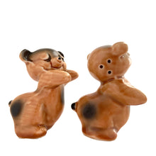 Load image into Gallery viewer, Vintage hand painted brown Snuggle Hugs hugging bears salt and pepper shakers. Designed by Ruth Van Tellingen, USA, 1940s. Add these adorable kitschy shakers to your collection!

In excellent condition, no chips/cracks/repairs. Faint impressed maker&#39;s mark on the bottom.

Measures 2 3/8 x 2 3/4 x 3 3/8 inches
