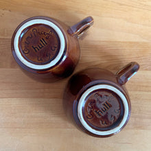 Load image into Gallery viewer, Jacks Daughter of All Trades Vintage Antique Mid-Century Kitsch Store Shop Reseller Etsy Shopify Toronto Canada Free Porch Pick Up Local Delivery Worldwide Shipping Judy Weinberg Unique Housewarming Gift Sustainable Gift Wedding Gift Home Decor Collectible Collector Gift Farmhouse Cottagecore Cottage Lodge Shabby Chic Industrial glossy brown drip glaze mug Hull Pottery 1960s hot beverage retro tableware
