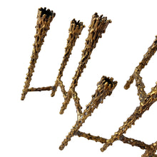Load image into Gallery viewer, Celebrate the Jewish Festival of Lights with this vintage mid-century era hand forged nine candle bronze Hanukkah / Chanukah menorah. This stunning piece of brutalist Judaica was crafted by American furniture maker, sculptor and designer, Paul Evans circa 1950s. Described by design historian, Dr. Daniella Ohad, as a radical metalsmith, Mr. Evan&#39;s work is highly sought after by collectors around the world. In excellent condition with patina. Measures 9 1/8 x 2 1/2 x 8 1/4 inches
