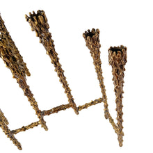 Load image into Gallery viewer, Celebrate the Jewish Festival of Lights with this vintage mid-century era hand forged nine candle bronze Hanukkah / Chanukah menorah. This stunning piece of brutalist Judaica was crafted by American furniture maker, sculptor and designer, Paul Evans circa 1950s. Described by design historian, Dr. Daniella Ohad, as a radical metalsmith, Mr. Evan&#39;s work is highly sought after by collectors around the world. In excellent condition with patina. Measures 9 1/8 x 2 1/2 x 8 1/4 inches
