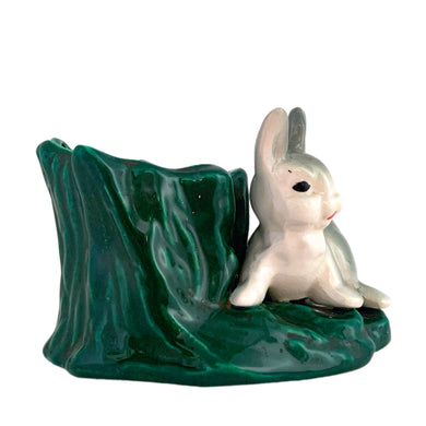 Adorable vintage ceramic planter featuring a white and gray bunny rabbit perched on a green tree stump. Crafted by Hollywood Ceramics California, USA, circa 1950s. Use this sweet planter to decorate your nursery, home or for your favourite succulent!  In excellent condition, free from chips.  Measures 5 1/4 x 3 3/4 x 3 1/4 inches