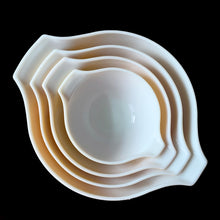 Load image into Gallery viewer, Set of four vintage Butterfly Gold 2 Cinderella nested mixing bowls. including the 441, 442, 443 and 444 sizes This classic was designed by Gregory Mirow and produced by PYREX, USA, 1979-1981. This version of the pattern features an asymmetrical flower and butterfly pattern in white alternating on golden-orange or golden-yellow ground. A must for the vintage kitchen and PYREX enthusiast!

Bowls are in excellent condition, shiny, no chips.

