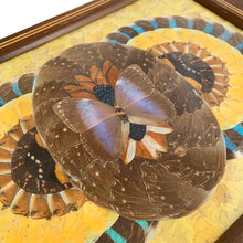 Load image into Gallery viewer, Rare vintage tone-on-tone wood inlaid handled tray with an artfully assembled geometric pattern of iridenscent colourful Morpho butterfly wings under glass. Crafted by artist Daniel Teixeira, Brazil, late 19th and early 20th century. This stunning indigenous folkart tray is sure to become your home&#39;s conversation piece!

In excellent vintage condition with typical age-related wear.

Measures 18 1/4 x 11 x 1 1/2 inches
