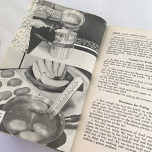 Load image into Gallery viewer, Vintage The Canadian Woman&#39;s Cookbook, hardcover book. Its 815 pages are jam-packed with a variety of recipes and practical information, colour and black &amp; white photos throughout. Edited by Ruth Berolzheimer who was the Director of Culinary Arts Institute in Toronto. Published in 1939 by the Atlantis Book Co., Canada. A superior reference book for the culinary enthusiast or anyone who wants a well-rounded cookbook to add to their collection!
