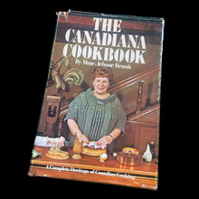Load image into Gallery viewer, Vintage The Canadiana Cookbook, hardcover cookbook &quot;a complete heritage of Canadian cooking&quot; with recipes organized by province. Written by Mme. Jehane Benoit, renowned Canadian culinary author, speaker, commentator, journalist and broadcaster during the 50s/60s/70s. Its 203 pages of regional recipes and line illustrations. Published by Pagurian Press, Canada, 1970, first edition. The bound book is in excellent condition showing normal age-related page yellowing and the jacket cover has wear and is torn.
