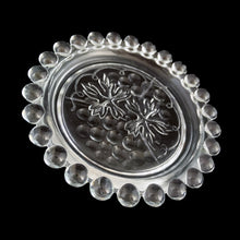 Load image into Gallery viewer, Set of six vintage Candlewick clear glass coasters impressed with grapevines and the distinctive Imperial Candlewick beaded edge. Crafted by Imperial Glass, USA, circa 1960s. The perfect way to protect your furniture and look great doing it! In great vintage condition, free from chips. Two coasters have a bit of roughness on the edge. Measures 4 x 5/8 inches
