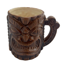 Load image into Gallery viewer, Groovy collectible vintage caramel brown handled tiki mug. Crafted by Orchids of Hawaii, Japan, 1950s. The perfect tropical addition to your retro drinkware collection!

In good vintage condition, no chips. Marked Orchids of Hawaii Japan

Measures 4 1/2 x 3 x 4 inches (incl. handle)
