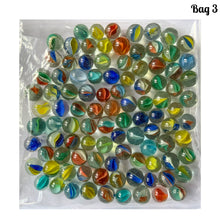 Load image into Gallery viewer, Iconic vintage Cat&#39;s Eye machine made marbles in a myriad of colours. One of the children&#39;s games of strategy and precision from the 1960s and 1970s. Purchased from the original owner. These take us back to a simpler time! These small colourful glass orbs make a wonderful display in glass jars, fish tanks and vases.  In good condition and cleaned with organic soap and water.  Each bag of marbles contains an assortment of colours in 9/16 inch / 14mm and 5/8 inch / 16mm
