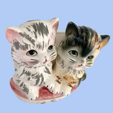 Load image into Gallery viewer, RARE vintage mid-century era kitsch anthropomorphic ceramic wall pocket planter featuring two cats sitting atop a pink cushion. Crafted by Lefton, Japan, 1950s. The perfect addition to your planter or cat collection!  In great vintage condition, tiny flea bite of the pink ear, no cracks/repairs. Marked ESD Japan Hand Painted 7229.  Measures 4 3/4 x 3 1/4 x 5 1/4 inches
